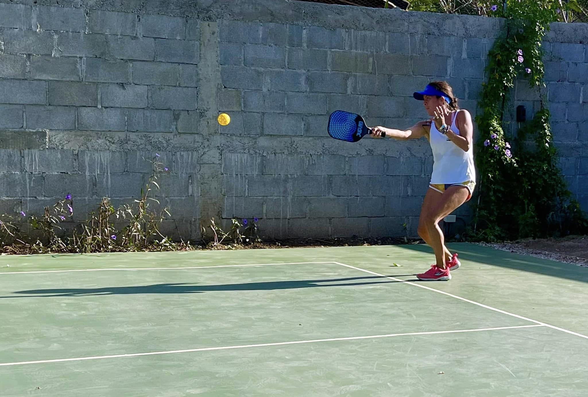 Woman playing pickleball in San Juan del Sur.