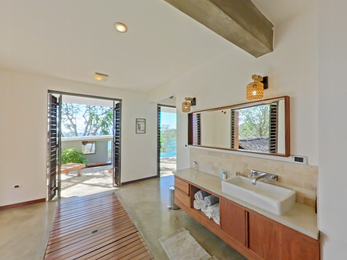 Bathroom sinks and glass door view