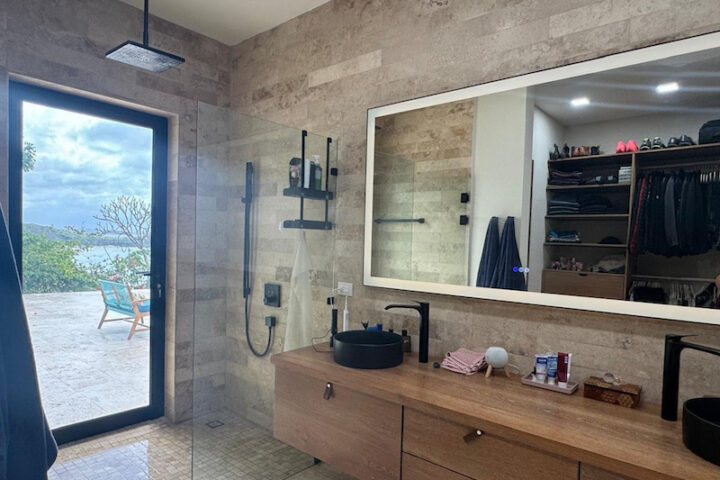 bathroom sinks with a glass door